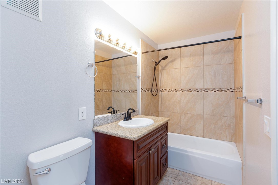 7950 West Flamingo Road, Unit 2072 Las Vegas, NV 89147 - Photo 28 of 36 2nd bathroom single sink with tile flooring