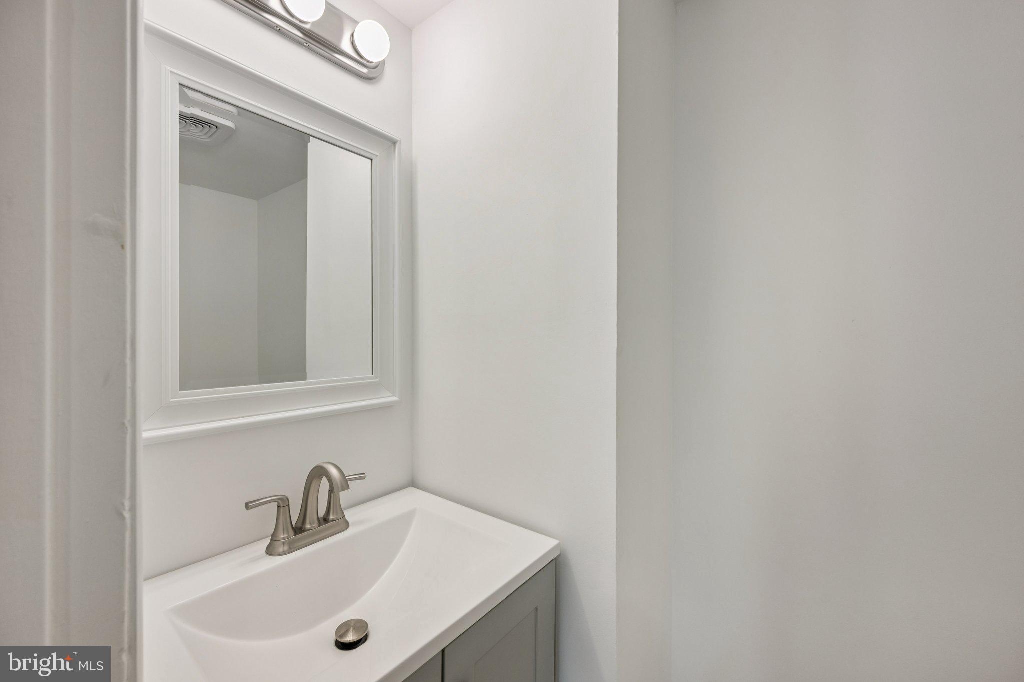 9801 Arbor Hill Drive Silver Spring, MD 20903 - Photo 11 of 28 Sleek and modern bathroom oasis.