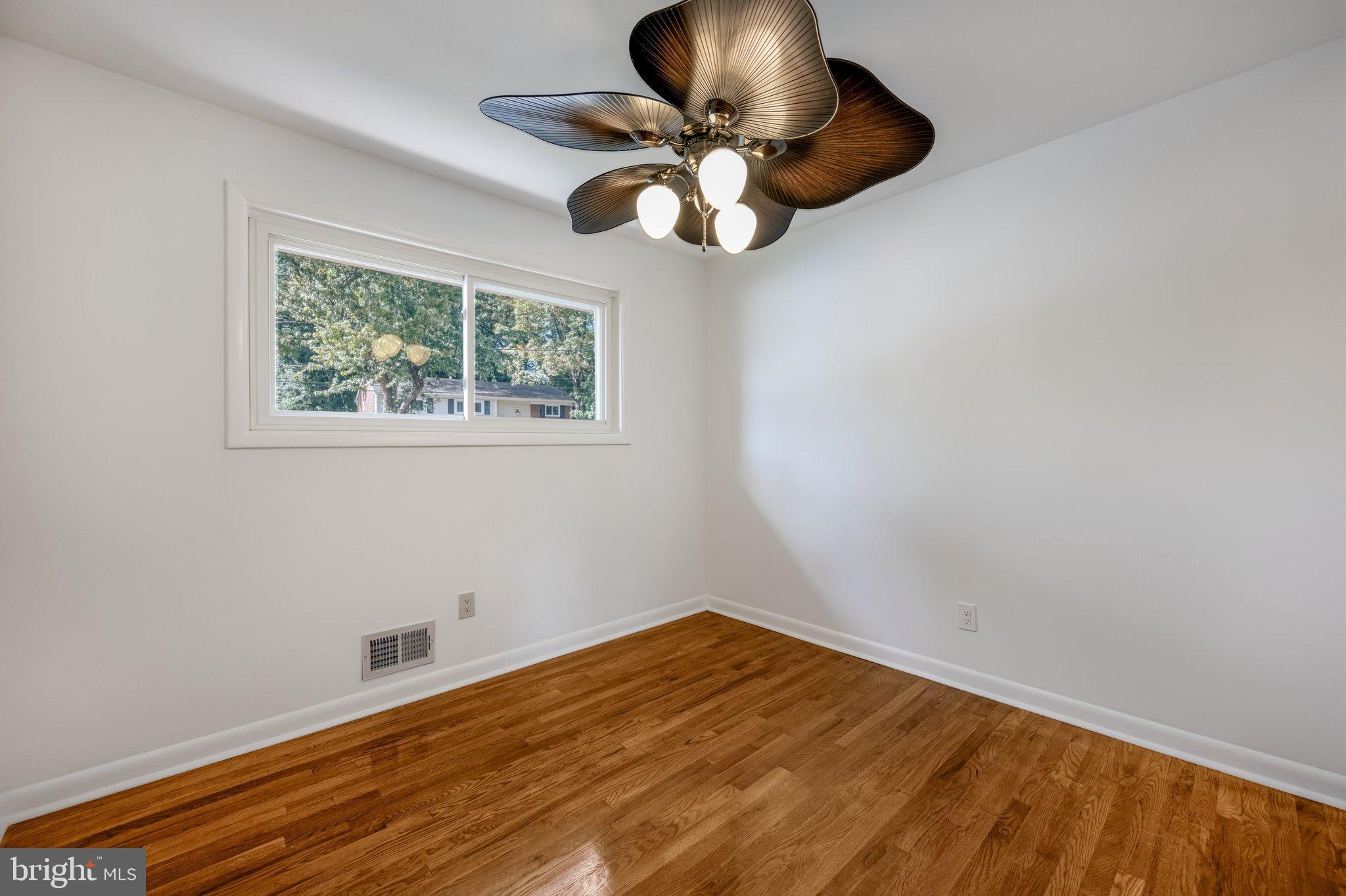9801 Arbor Hill Drive Silver Spring, MD 20903 - Photo 12 of 28 Bright and airy room with hardwood floors.