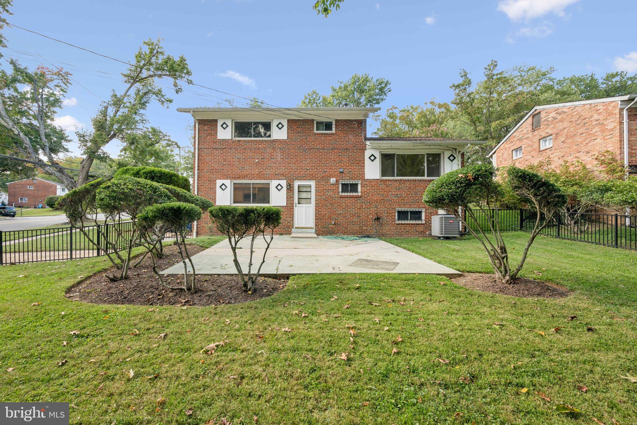 9801 Arbor Hill Drive Silver Spring, MD 20903 - Photo 22 of 28 Charming brick home with lush green yard.