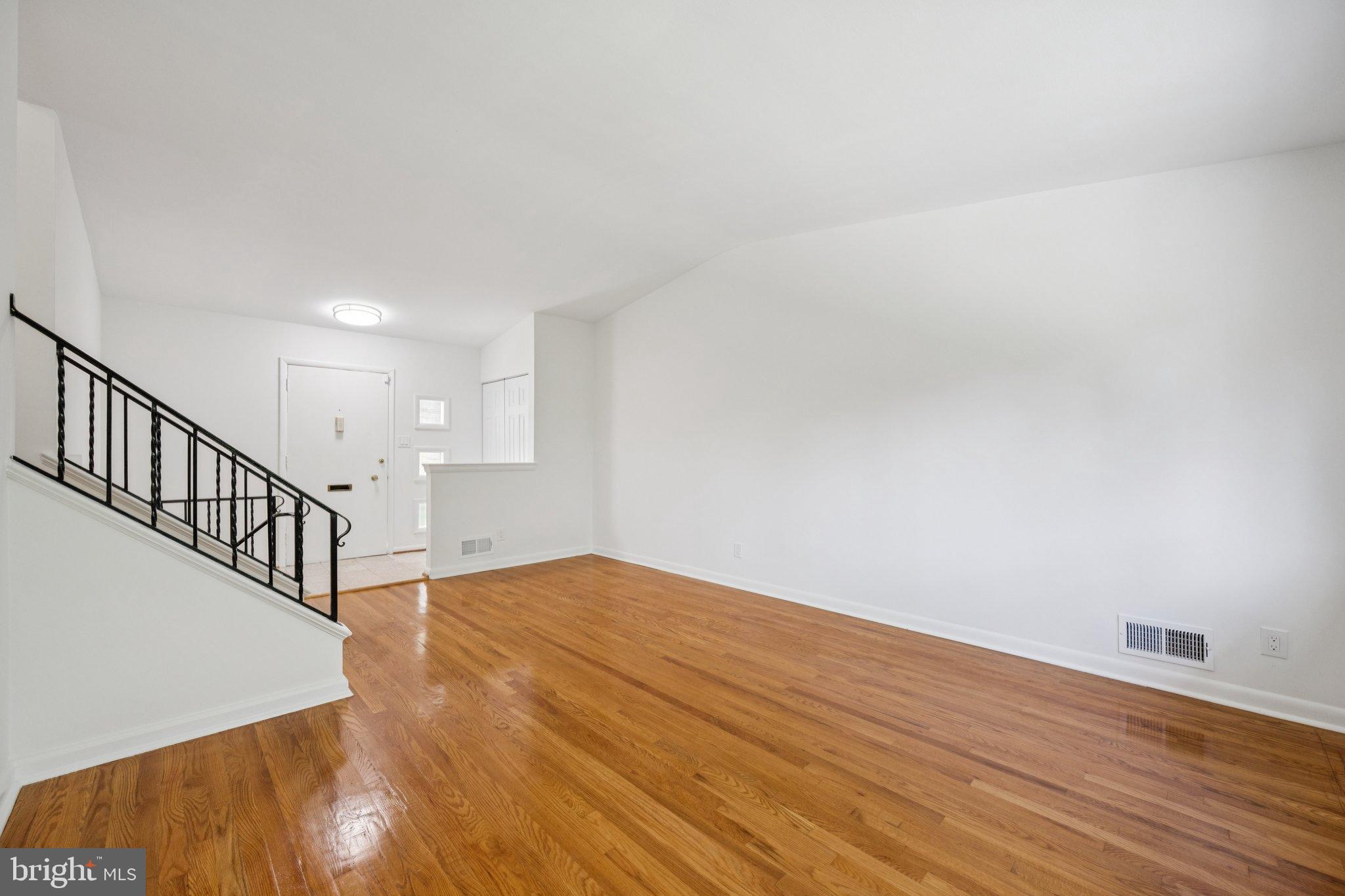 9801 Arbor Hill Drive Silver Spring, MD 20903 - Photo 4 of 28 Spacious, sunlit living area awaits your touch.