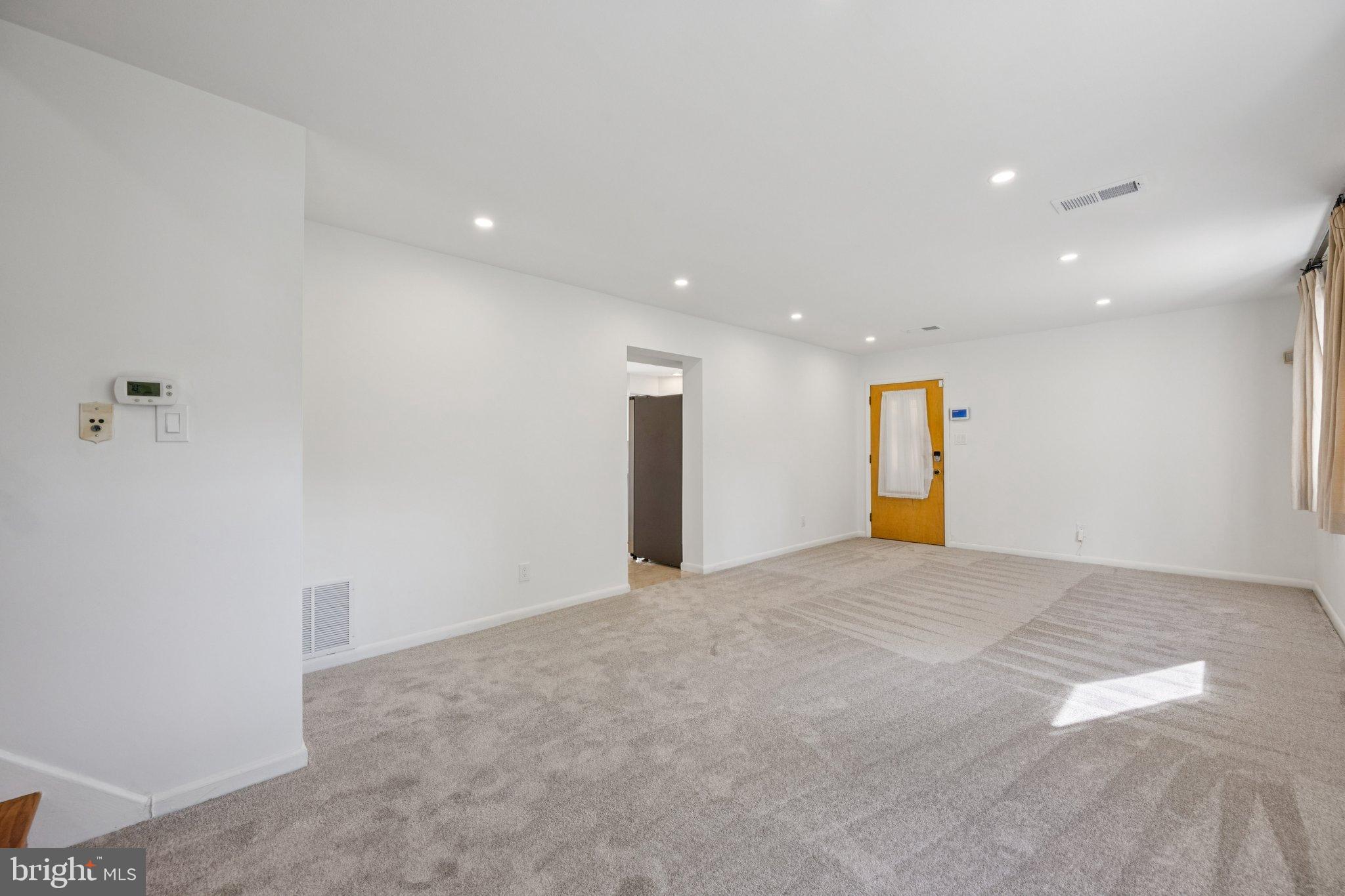 9801 Arbor Hill Drive Silver Spring, MD 20903 - Photo 7 of 28 Spacious, light-filled living area awaits you.