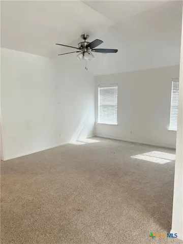 a view of a room that has a window