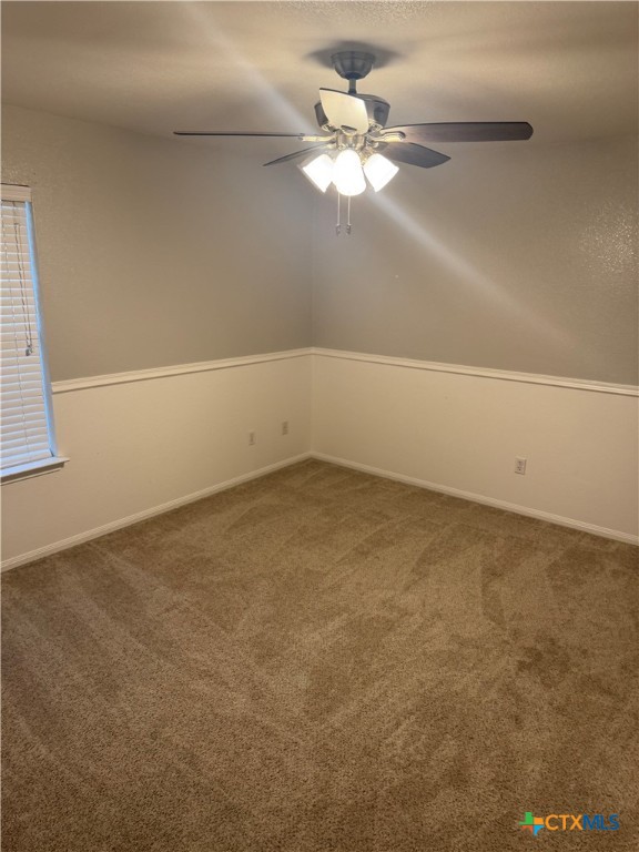 311 Crowfoot Drive Harker Heights, TX 76548 - Photo 16 of 21 an empty room with a chandelier fan and windows