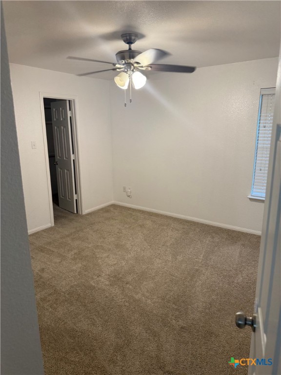 311 Crowfoot Drive Harker Heights, TX 76548 - Photo 18 of 21 an empty room with a chandelier fan
