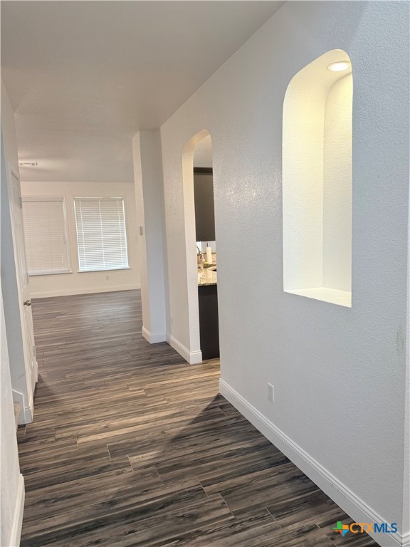 311 Crowfoot Drive Harker Heights, TX 76548 - Photo 5 of 21 a view of an empty room with wooden floor and a window
