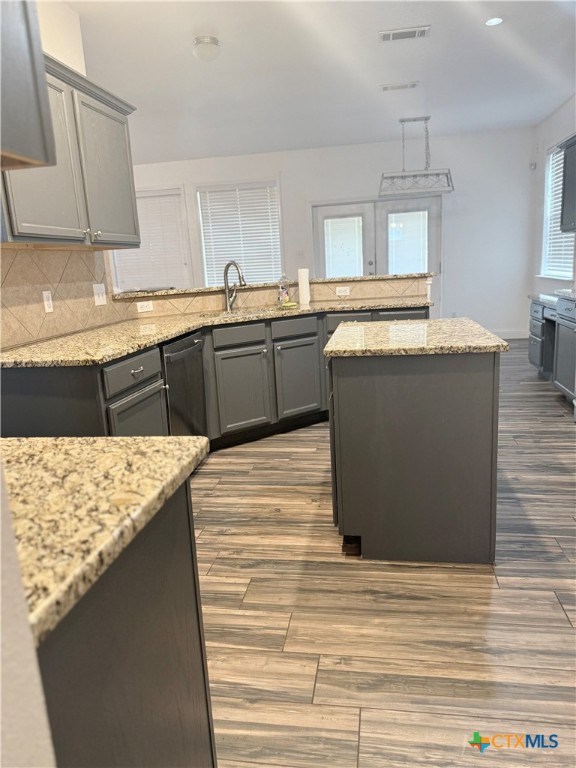 311 Crowfoot Drive Harker Heights, TX 76548 - Photo 6 of 21 a kitchen with a sink refrigerator and cabinets