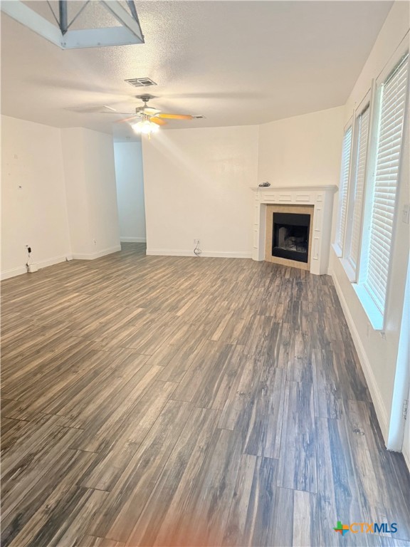 311 Crowfoot Drive Harker Heights, TX 76548 - Photo 8 of 21 a view of empty room with wooden floor and fireplace