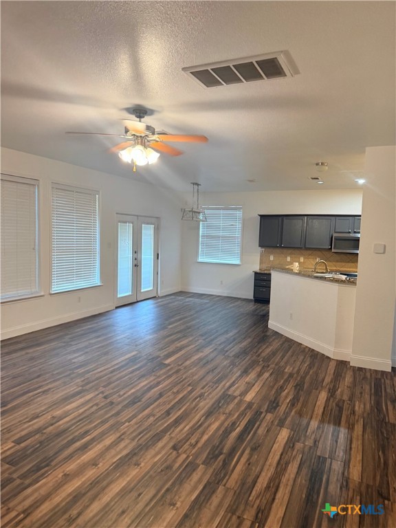 311 Crowfoot Drive Harker Heights, TX 76548 - Photo 9 of 21 a view of a room with a ceiling fan hardwood floor and a ceiling fan