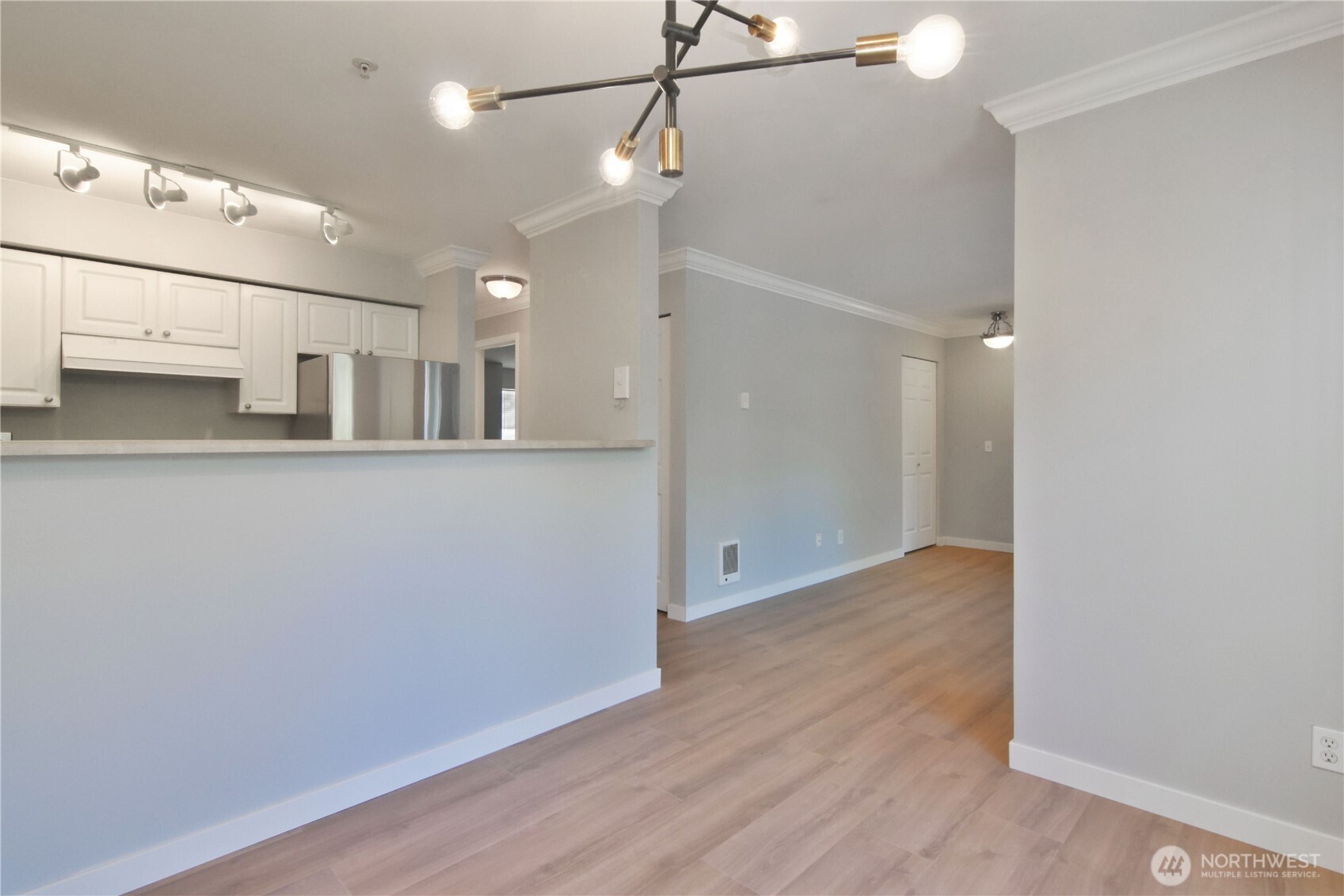 33020 10th Avenue Southwest, Unit Z203 Federal Way, WA 98023 - Photo 11 of 25 a view of a kitchen with a refrigerator and a stove