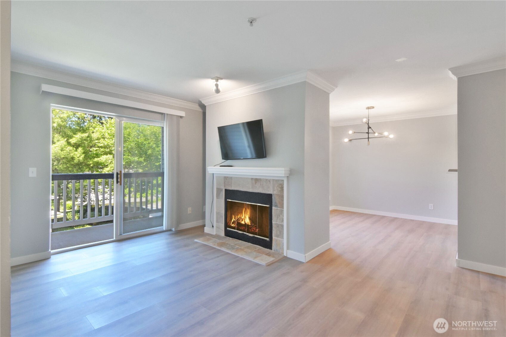 33020 10th Avenue Southwest, Unit Z203 Federal Way, WA 98023 - Photo 2 of 25 a view of an empty room with wooden floor and a window