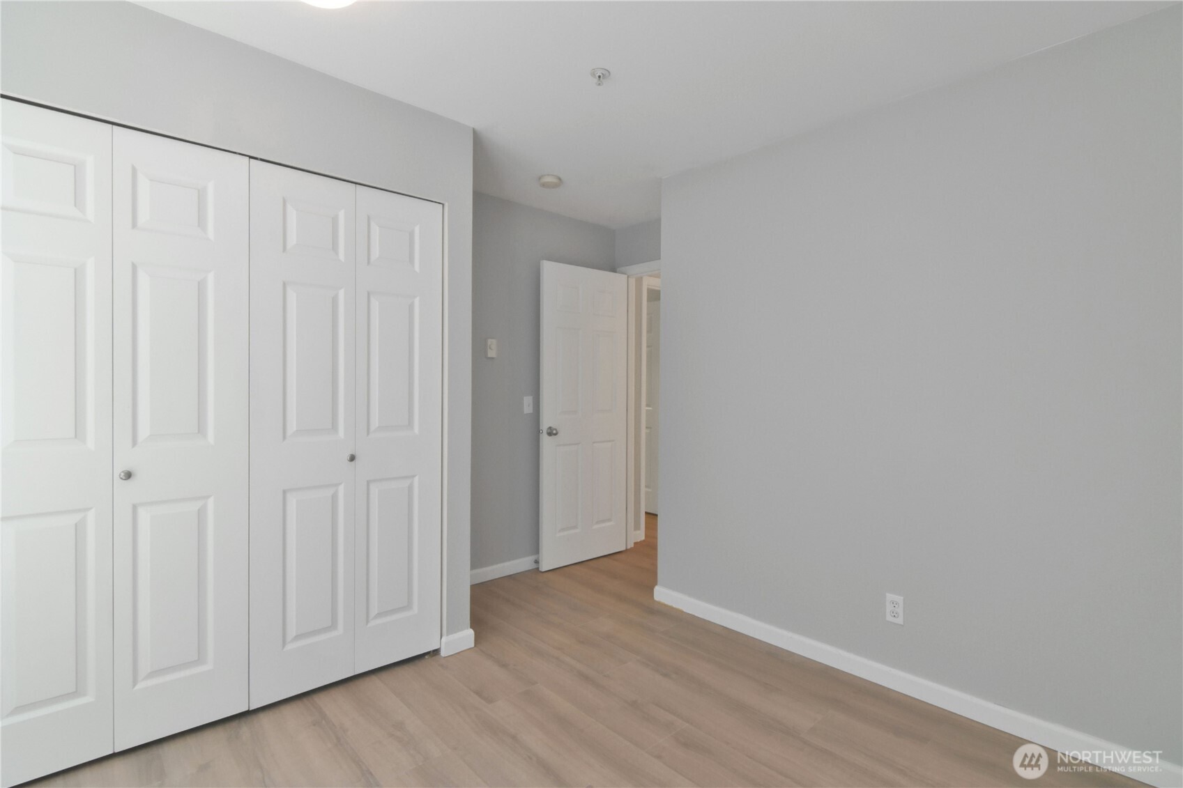 33020 10th Avenue Southwest, Unit Z203 Federal Way, WA 98023 - Photo 21 of 25 a view of an empty room with wooden floor