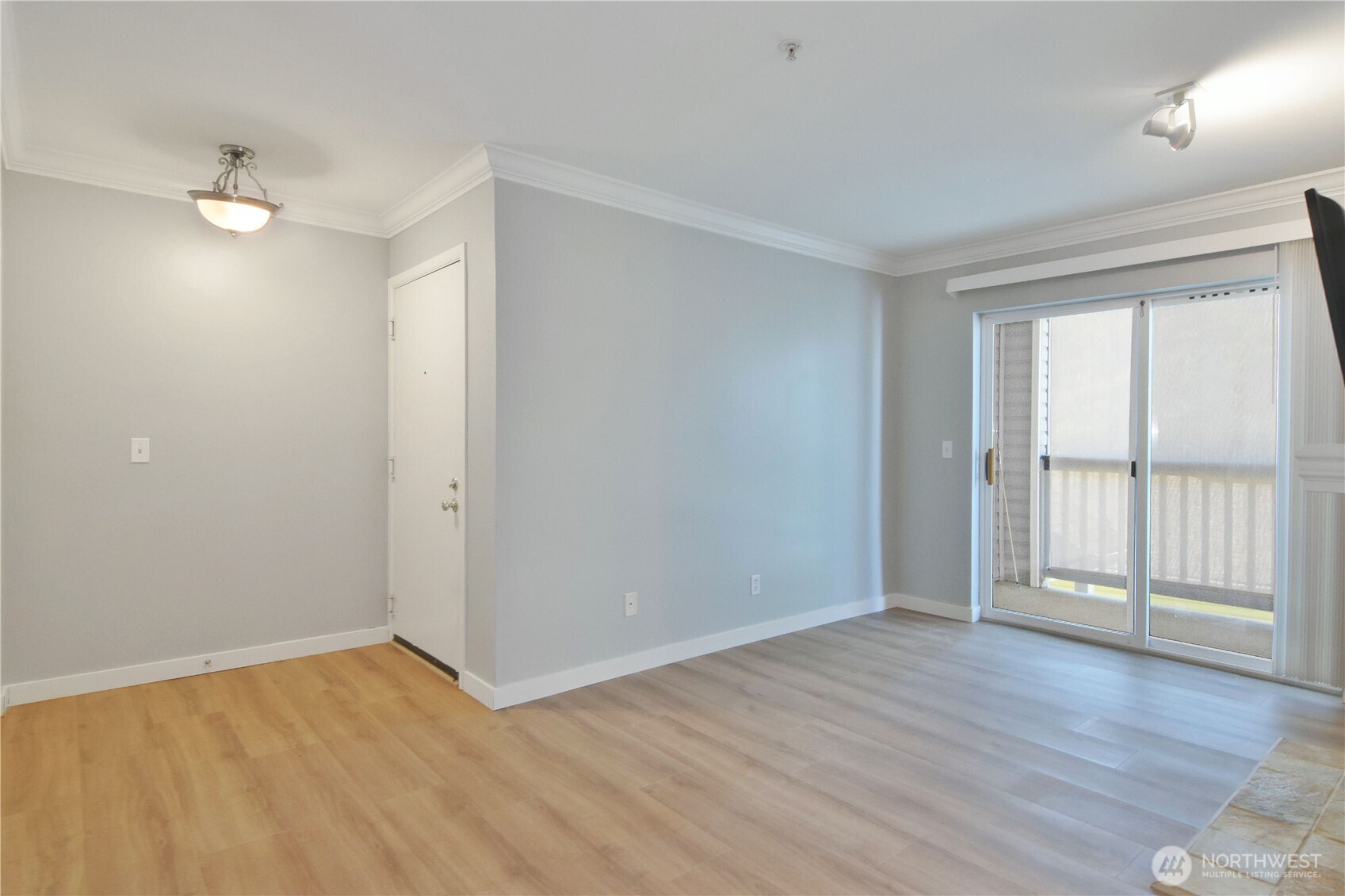 33020 10th Avenue Southwest, Unit Z203 Federal Way, WA 98023 - Photo 6 of 25 an empty room with wooden floor and windows