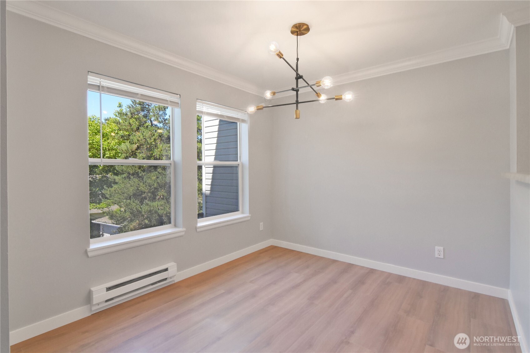 33020 10th Avenue Southwest, Unit Z203 Federal Way, WA 98023 - Photo 9 of 25 a view of empty room with window and wooden floor