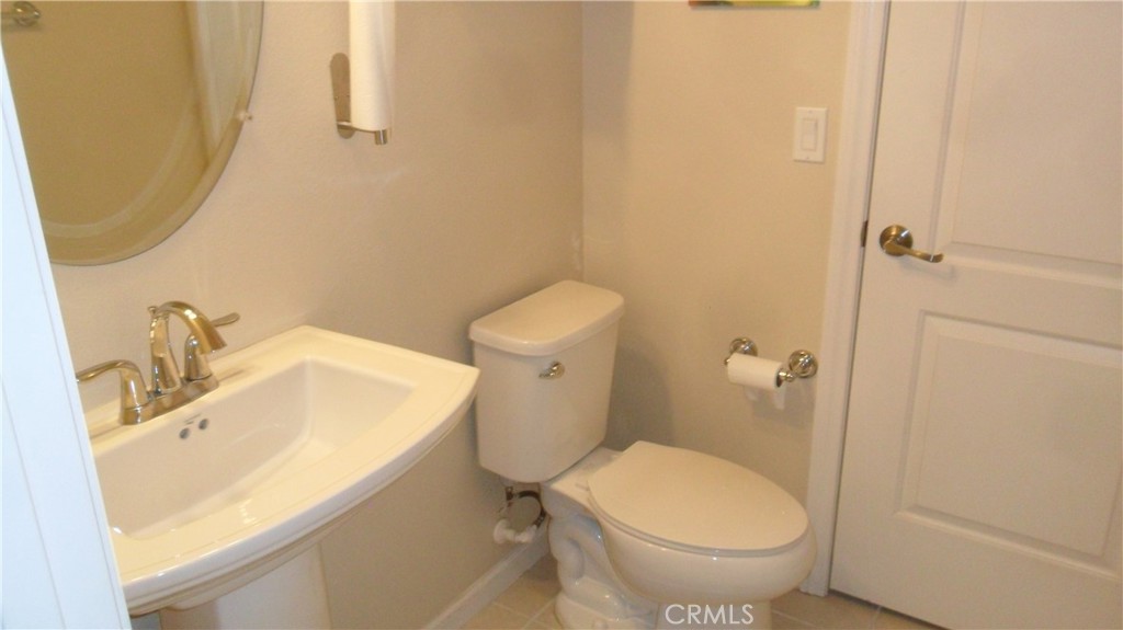 36277 Waxen Road Lake Elsinore, CA 92532 - Photo 11 of 27 a bathroom with a sink and a toilet