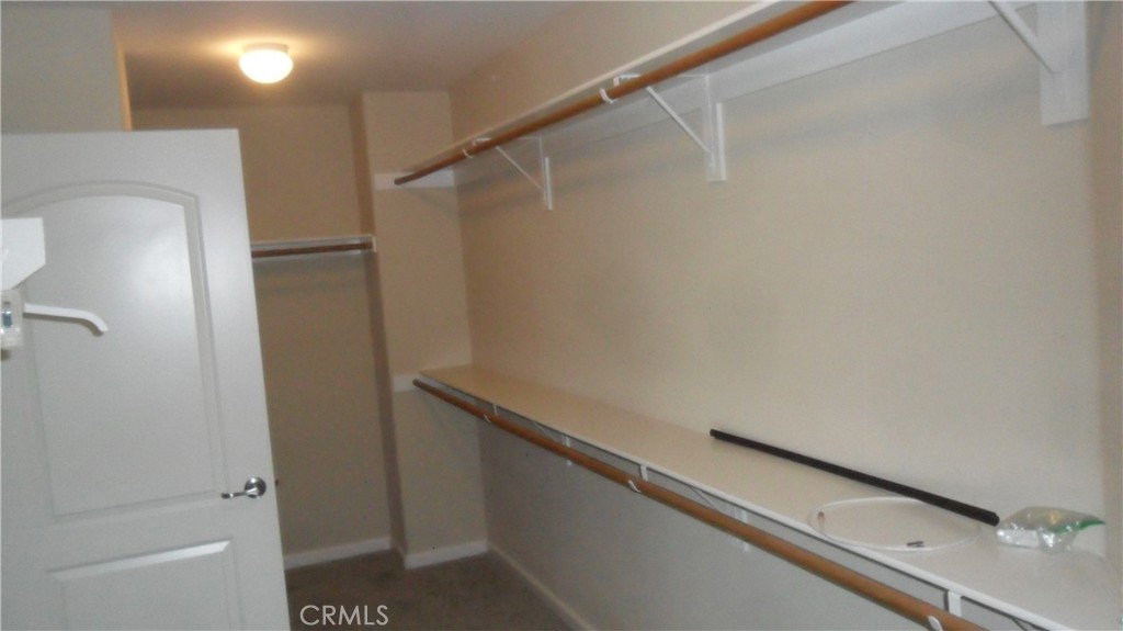 36277 Waxen Road Lake Elsinore, CA 92532 - Photo 17 of 27 a view of a room with racks on the wall