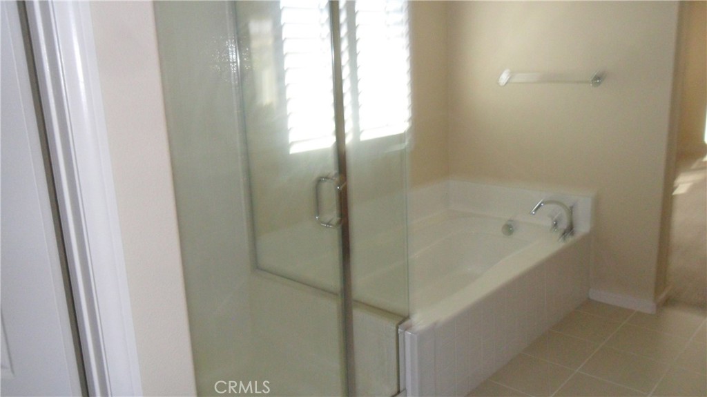 36277 Waxen Road Lake Elsinore, CA 92532 - Photo 18 of 27 a bathroom with a bathtub and shower