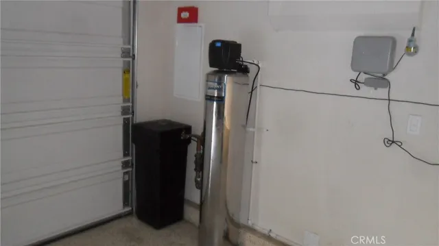 a view of a patio with table and chairs potted plants