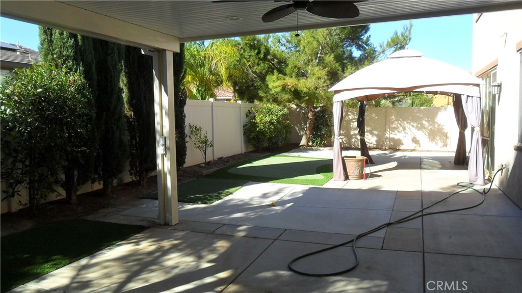 36277 Waxen Road Lake Elsinore, CA 92532 - Photo 24 of 27 a view of a porch with furniture and garden