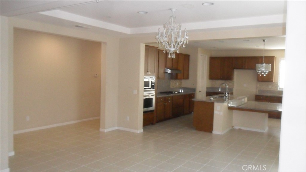 36277 Waxen Road Lake Elsinore, CA 92532 - Photo 6 of 27 a view of a kitchen with a sink and cabinets