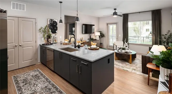 a kitchen with a sink refrigerator and window