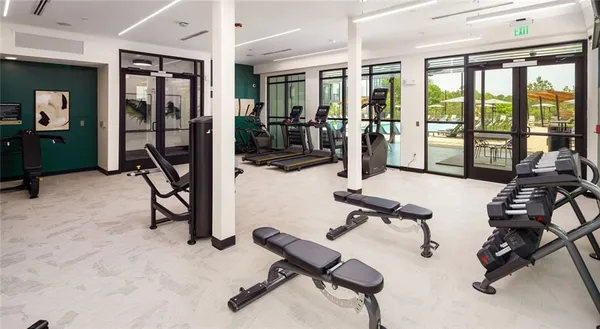 a view of game room with window and gym equipment