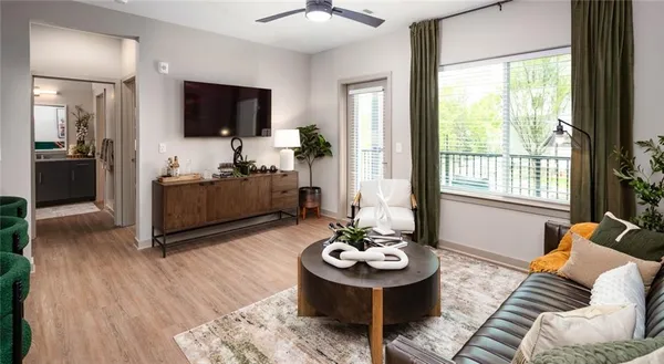 a kitchen with a stove a sink and a microwave