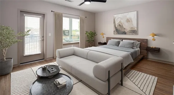 a living room with furniture and a wooden floor