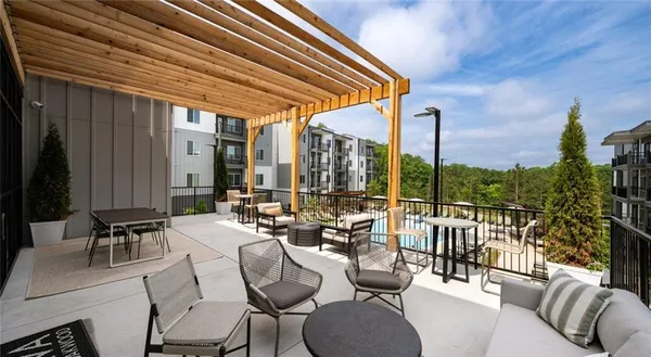 a view of balcony with chairs and outdoor seating