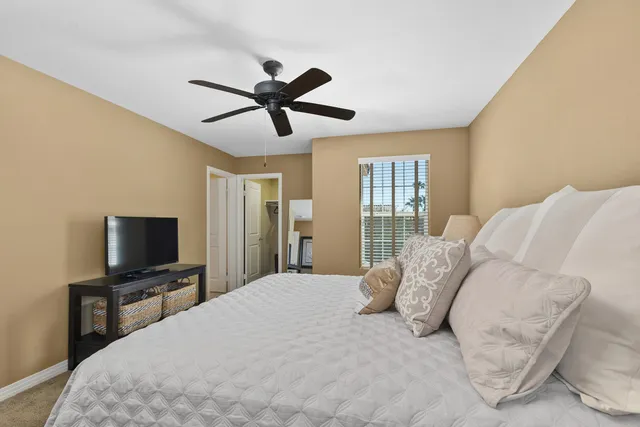 a bathroom with a double vanity sink toilet and a mirror