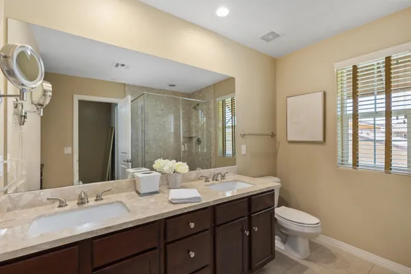 a bedroom with a bed and a desk