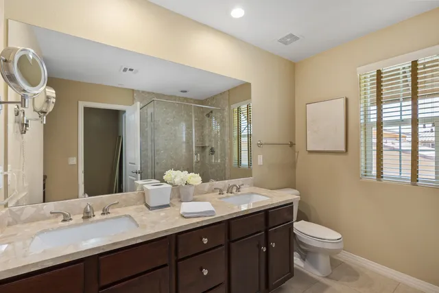 a bedroom with a bed and a desk