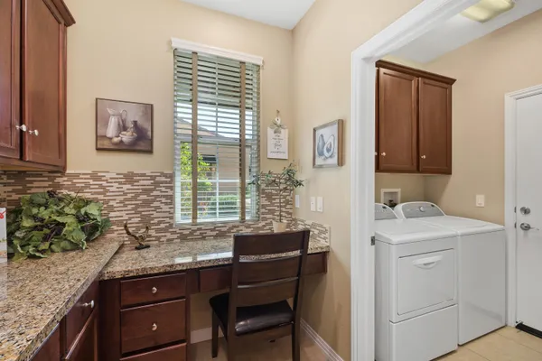 a view of a kitchen and an window