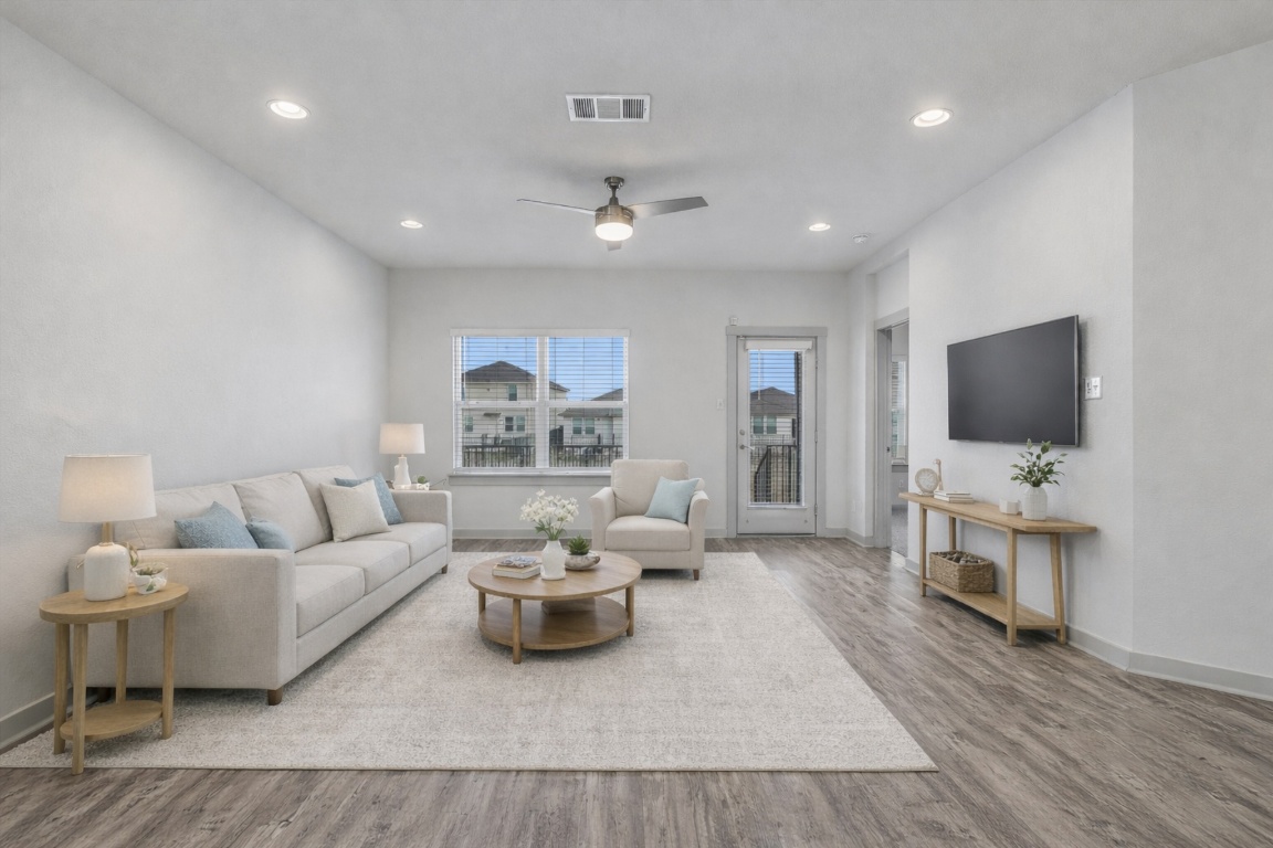 5125 Vanner Path Georgetown, TX 78626 - Photo 4 of 27 Living room with wood finished floors, ceiling fan, and recessed lighting. Digitally Staged.