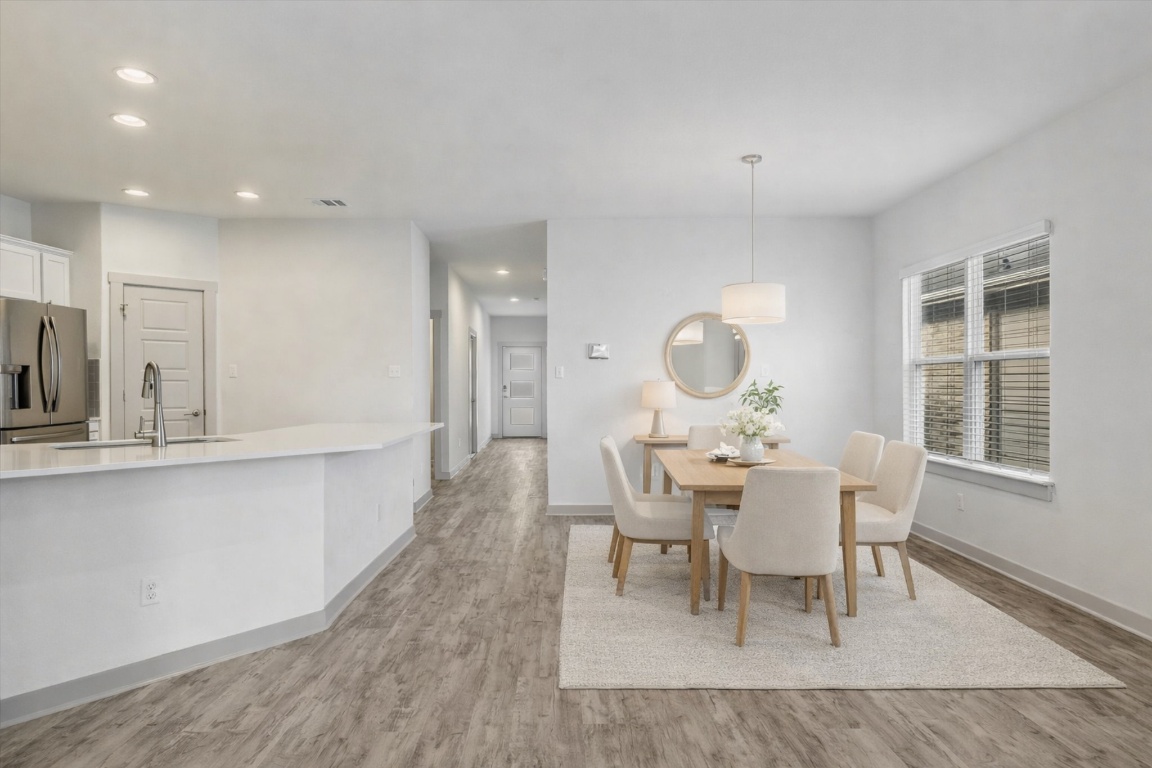 5125 Vanner Path Georgetown, TX 78626 - Photo 6 of 27 Dining space with light wood-type flooring and recessed lighting. Digitally Staged.
