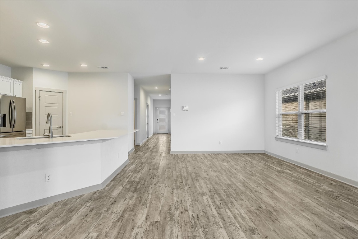 5125 Vanner Path Georgetown, TX 78626 - Photo 7 of 27 Unfurnished living room with light wood finished floors and recessed lighting