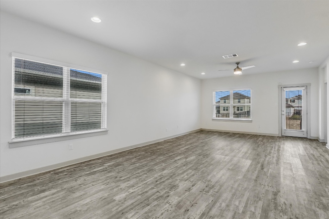5125 Vanner Path Georgetown, TX 78626 - Photo 9 of 27 Empty room featuring light wood-style floors, recessed lighting, and ceiling fan