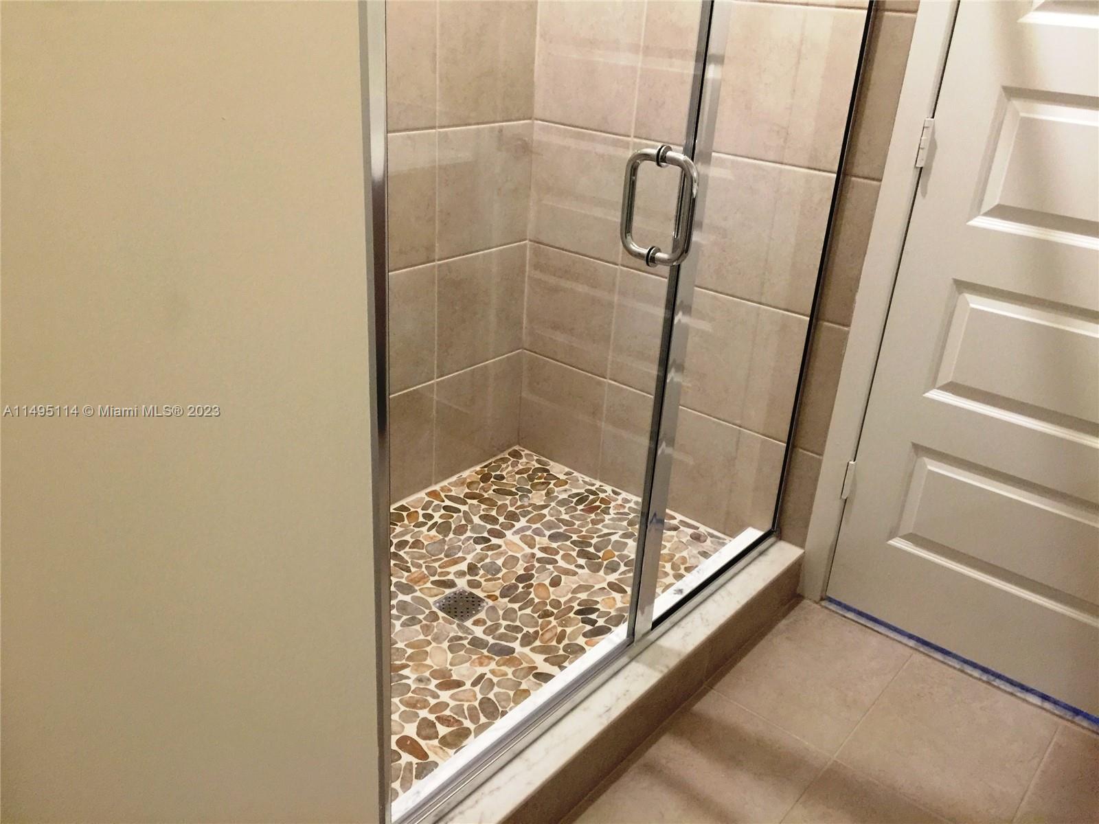 Doral Doral, FL 33178 - Photo 7 of 18 a bathroom with a shower