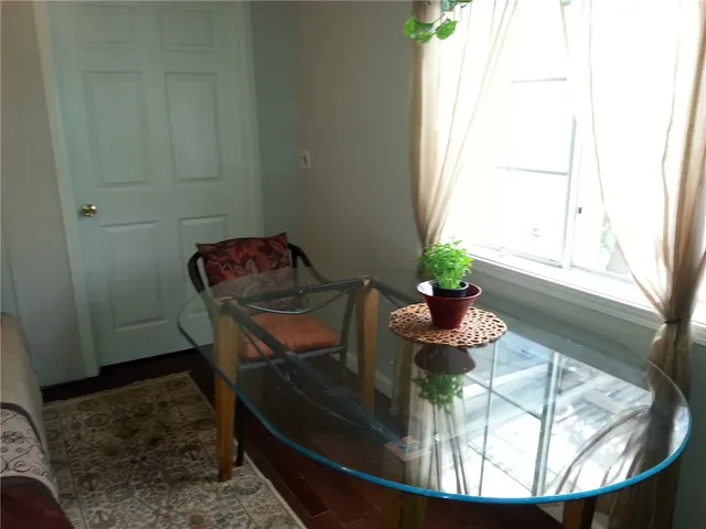a white toilet sitting next to a bathroom sink