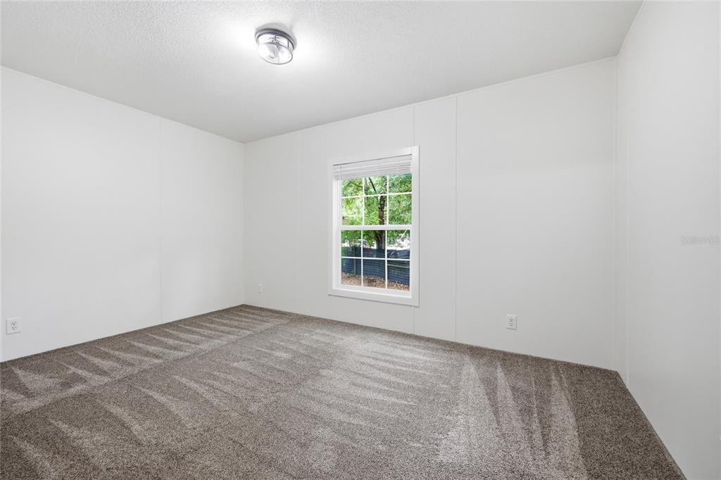 215 Southwest Alpine Place High Springs, FL 32643 - Photo 23 of 41 an empty room with a window