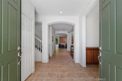 a view of a hallway with a furniture and a livingroom