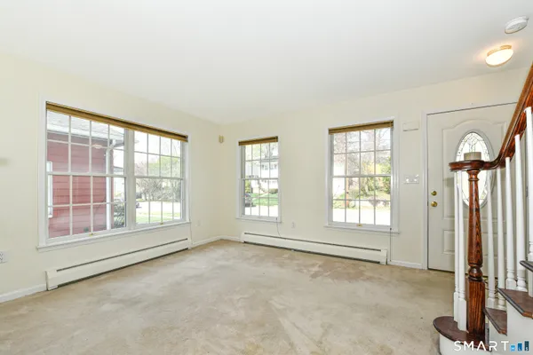 a view of an empty room with a window