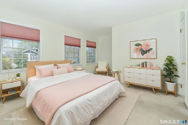 a bed room with a bed and a desk