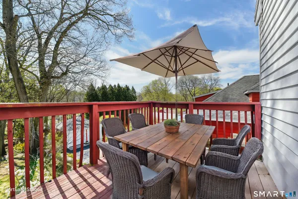 a view of a balcony with furniture