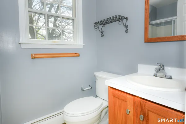 a bathroom with a glass shower door