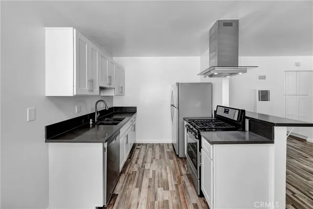 a kitchen with a stove and a sink