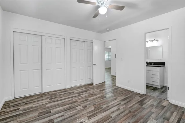 a view of a livingroom with wooden floor