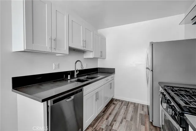 a kitchen with a sink and cabinets