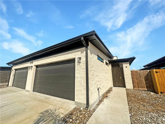 a view of kitchen with microwave and refrigerator
