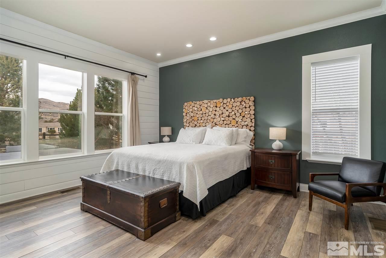 8475 Fairway Chase Trail Reno, NV 89523 - Photo 12 of 40 a bed sitting in a spacious bedroom next to a window